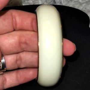 White with gold trim bracelet. Good condition